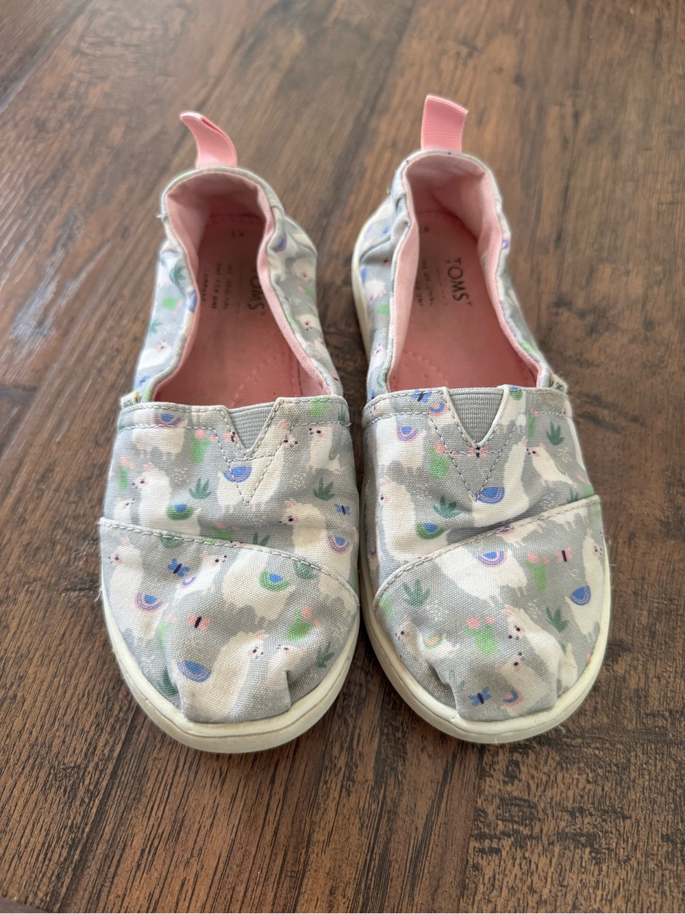 TOMS Kids Llama Print Slip-Ons in Gray and Pink